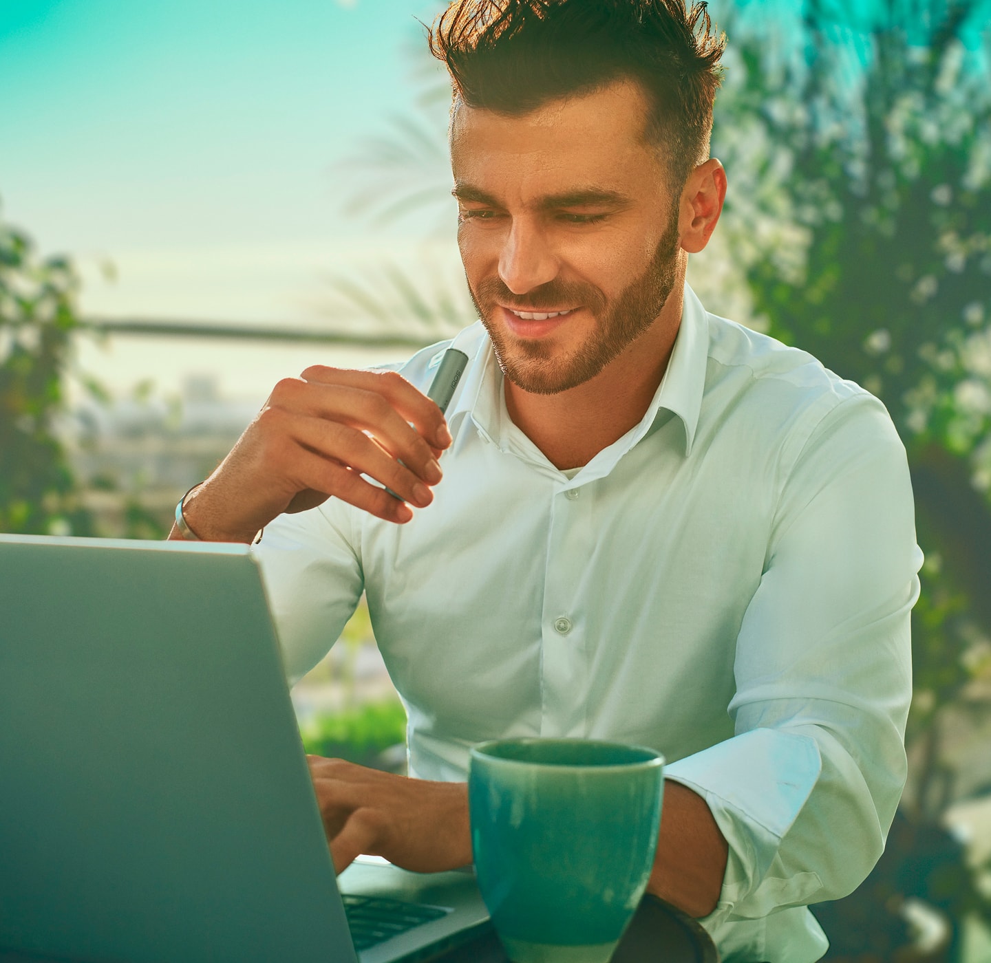 A man using an IQOS device.